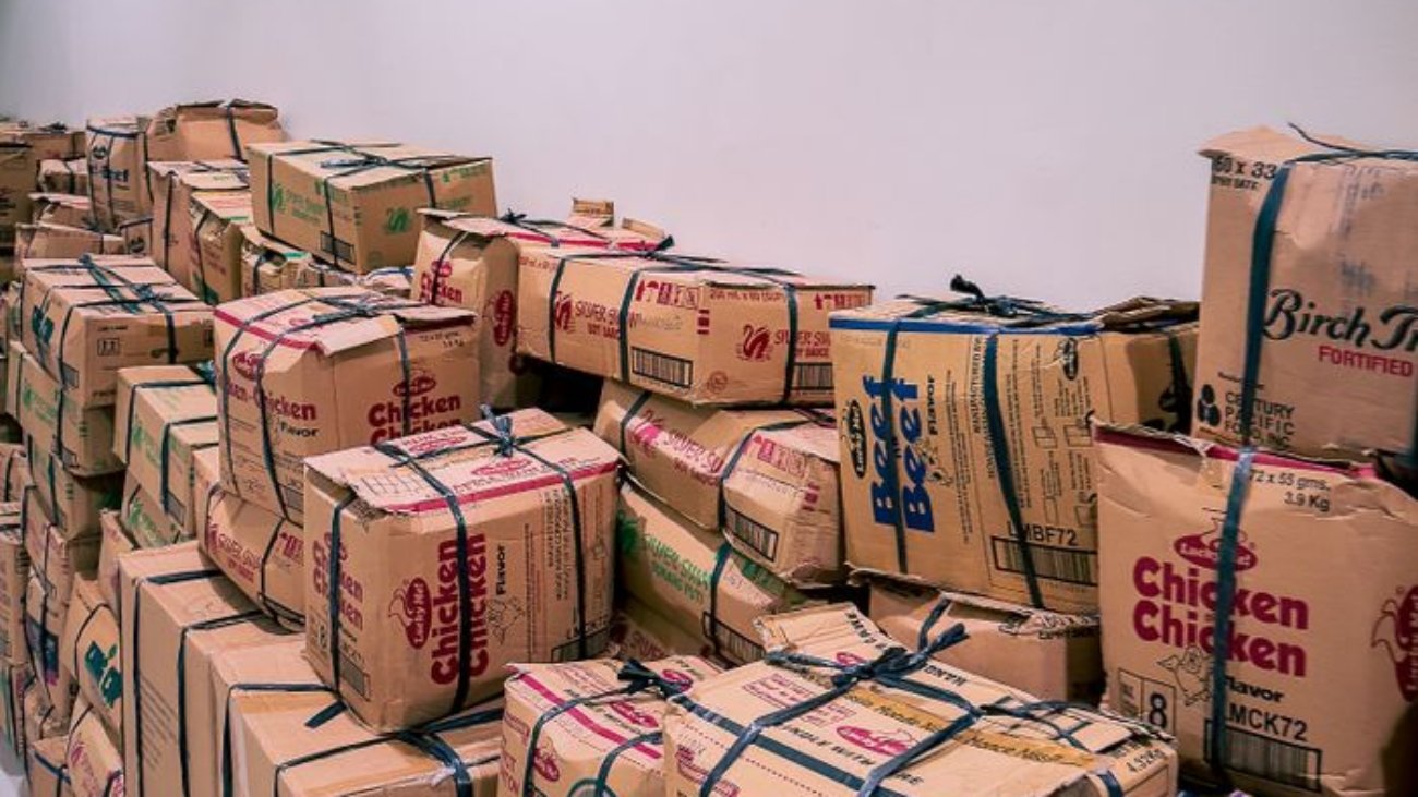Large stack of cardboard boxes in a warehouse setting in Central Visayas, Philippines.